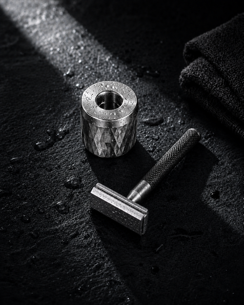 Close view of the SteelDock stand base, machined aluminium with a weighted foot